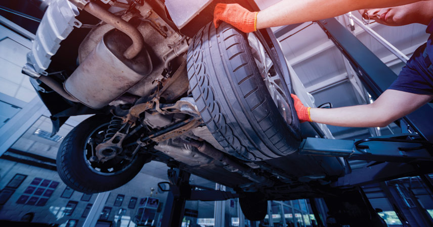 Auto mechanic working on a vehicle at Roberts Complete Auto Care in Barrie Ontario.