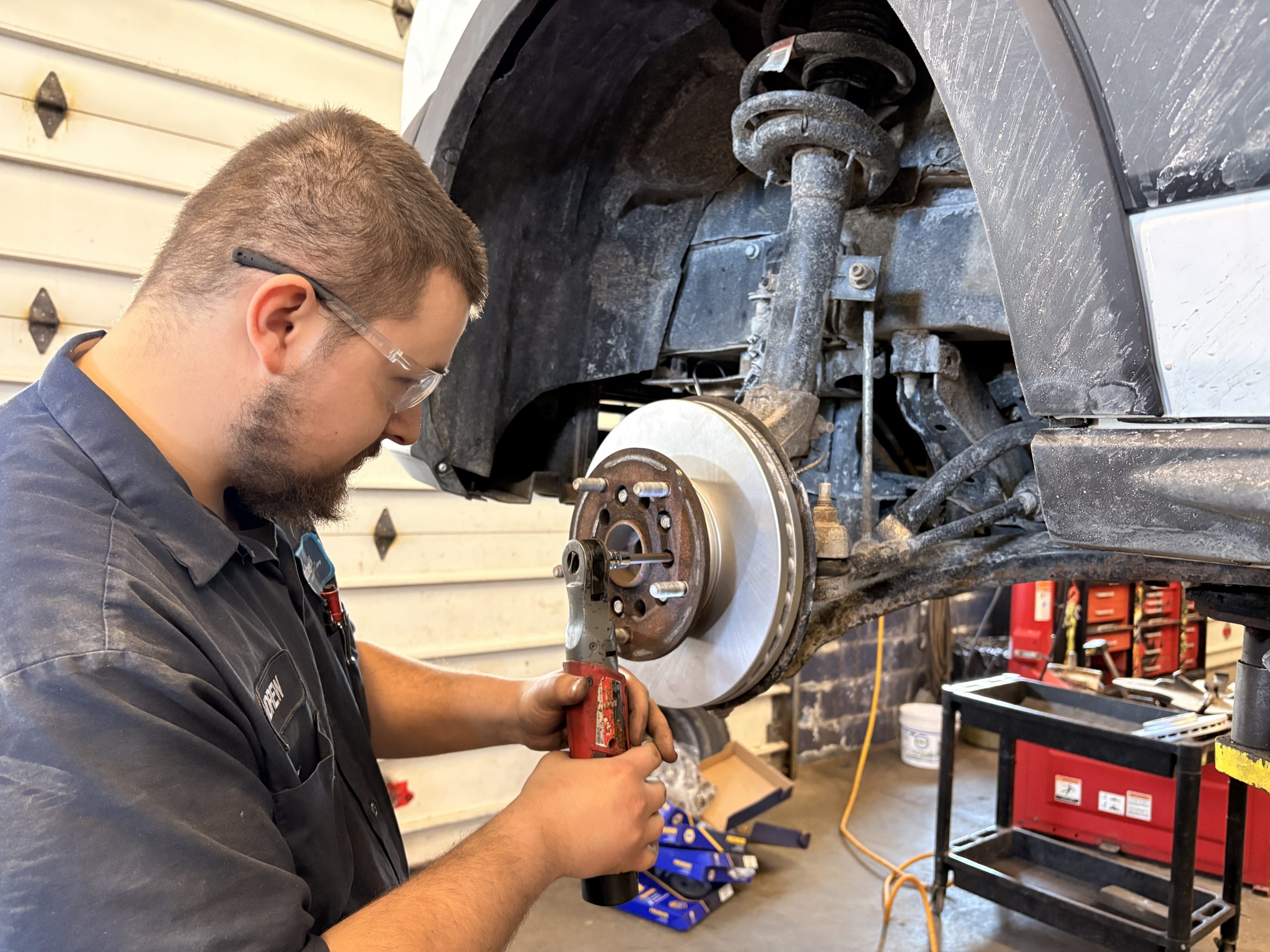 Brake repair Barrie - technician inspecting brake system at Roberts Complete Auto Care